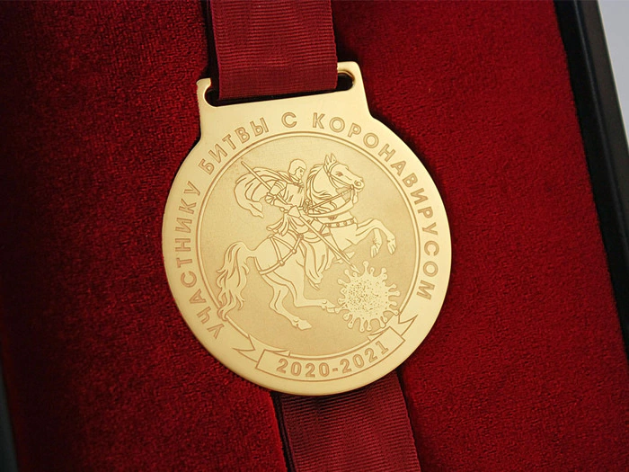 Corporate medal in a transformer stand